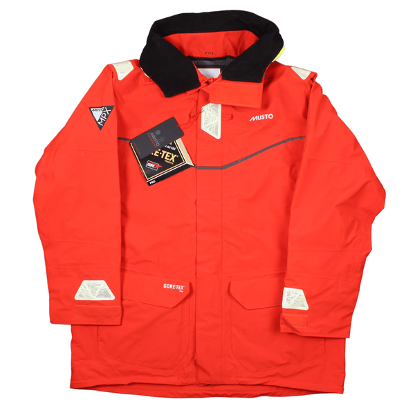 Front view of the Musto MPX Gore-tex Pro Off shore jacket in Fire Orange. Displaying reflective patches on the arms and shoulders, the roll neck collar and the MPX Musto branding